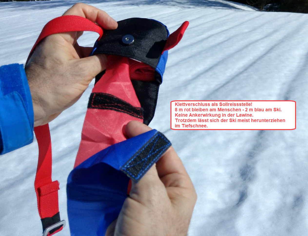 Sollreisstelle zwischen find---me LAwinenband (rot) und Tiefschneeband (blau). Verhindert Verletzungen im Tiefschnee und Ankerwirkung in der Lawine.